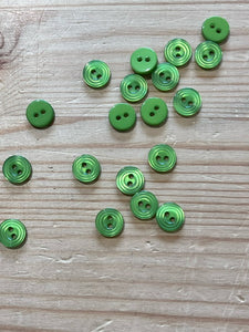 02-2633 End of line  Green Shirt Button 16L x 10