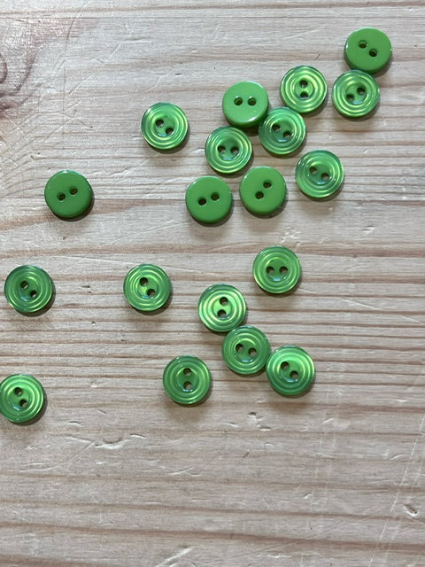 02-2433 End of line  Green Shirt Button 16L x 10