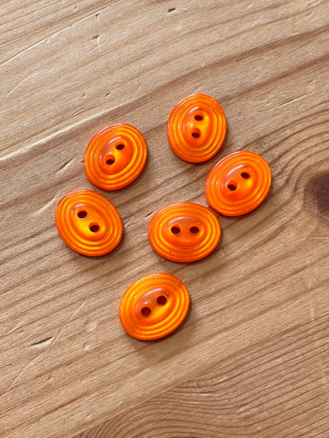 27-K157  Orange Oval Button- 24L x 10