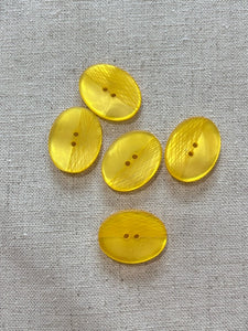 27-K161 Laser Yellow Oval Button- 32L