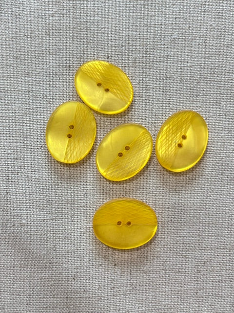 27-K161 Laser Yellow Oval Button- 32L